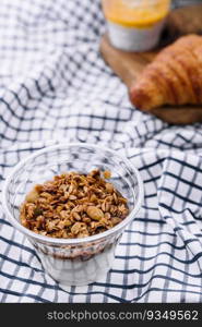 Delicious breakfast with granola and croissant