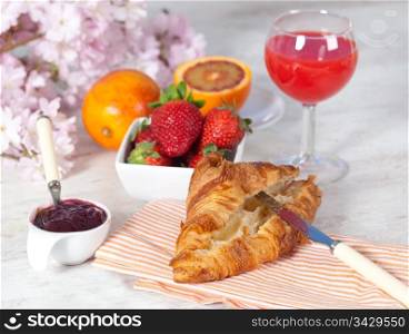 Delicious breakfast withorange juice and croissant