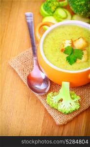 Delicious broccoli and zucchini cream soup, tasty seasonal dish, vegetarian food, healthy organic nutrition