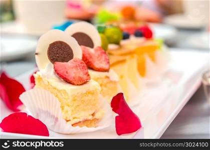 Delicious cake on plate on table