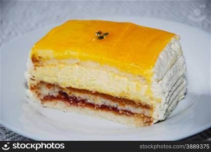 Delicious cake with cream and yellow jelly top