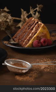 Delicious caramel cake slice with blackberries and raspberries.