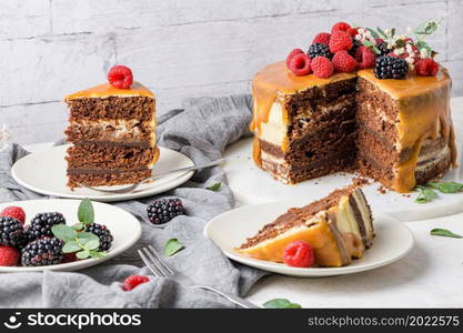 Delicious caramel cake with blackberries and raspberries.