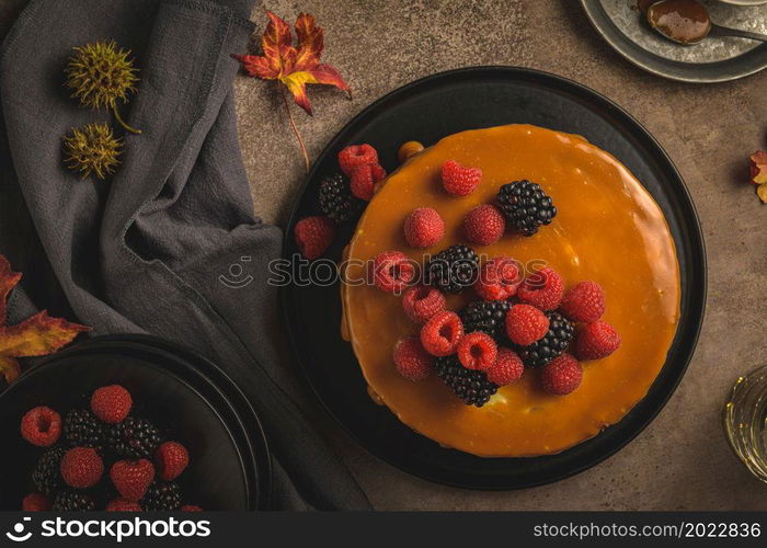 Delicious caramel cake with blackberries and raspberries.