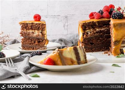 Delicious caramel cake with blackberries and raspberries.
