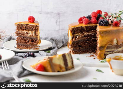 Delicious caramel cake with blackberries and raspberries.