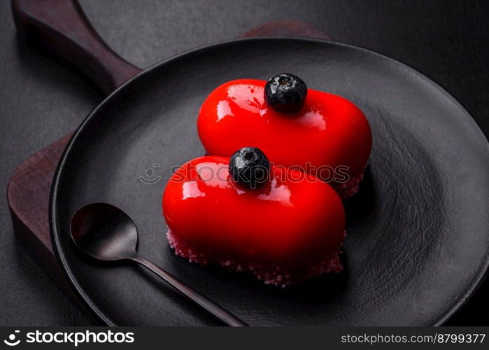  Delicious cheese cakes with red coating made for Valentine’s holiday. Sweets for the holiday table