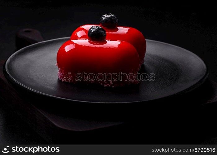  Delicious cheese cakes with red coating made for Valentine’s holiday. Sweets for the holiday table