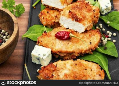 Delicious chicken breast roasted in breadcrumbs. Fast food. Dietary baked chicken breast.
