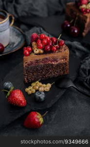 Delicious chocolate cake decorated with fresh berries