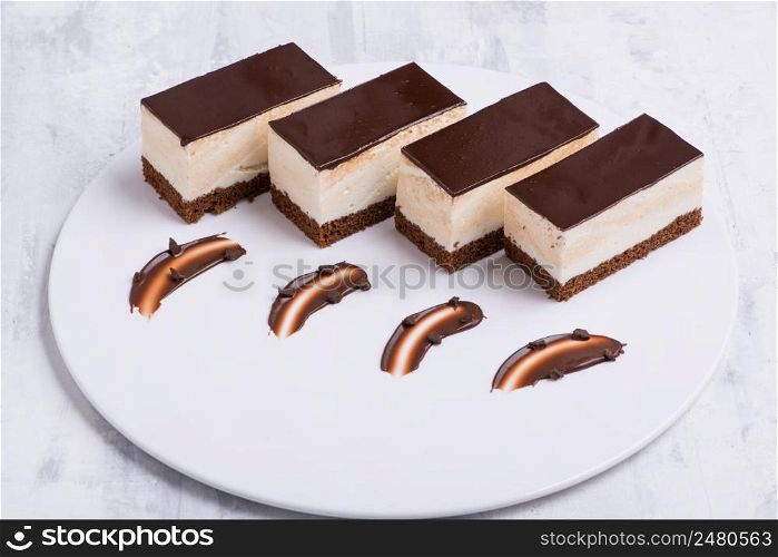 delicious chocolate cake on a white plate. sweets on white background