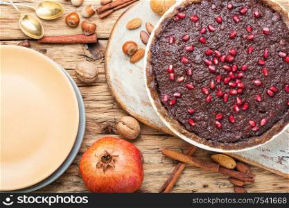Delicious chocolate cake with nut.Vegan chocolate cake. Chocolate cake with pomegranate