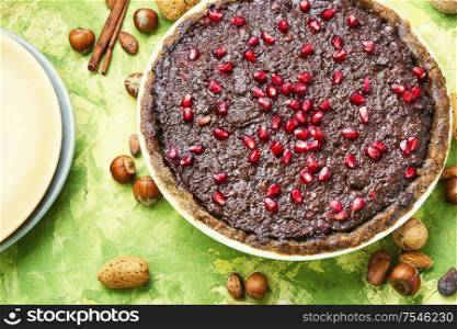 Delicious chocolate cake with pomegranate and nut.Chocolate brownie cake. Chocolate cake with pomegranate