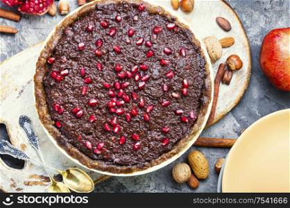 Delicious chocolate cake with pomegranate and nut.. Chocolate cake with pomegranate
