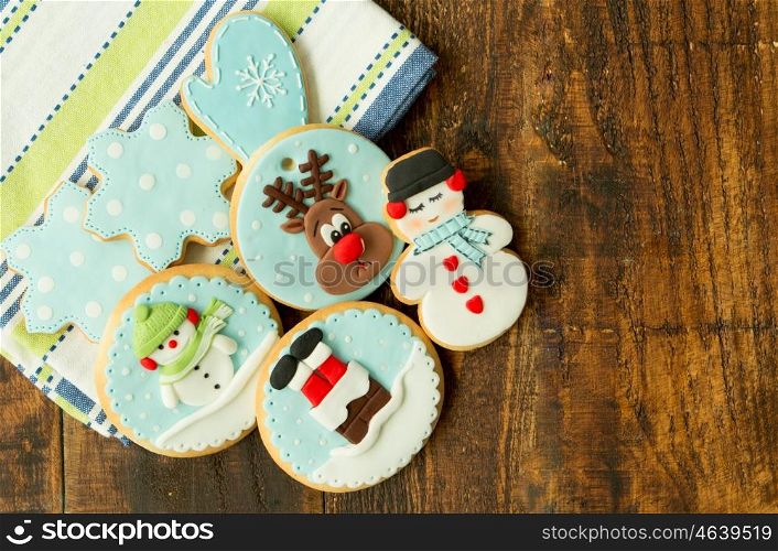 Delicious Christmas cookies in blue tone on a wooden table