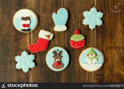 Delicious Christmas cookies in blue tone on a wooden table