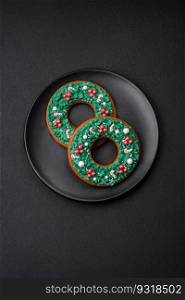 Delicious Christmas gingerbread on a dark textural background. Preparing to celebrate Christmas and New Year