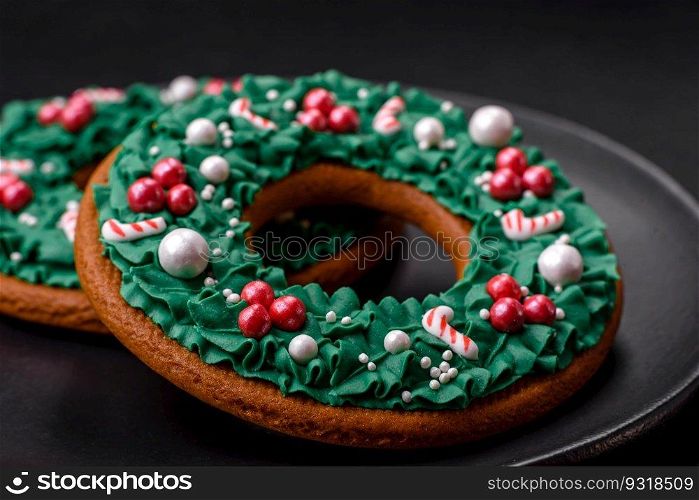 Delicious Christmas gingerbread on a dark textural background. Preparing to celebrate Christmas and New Year