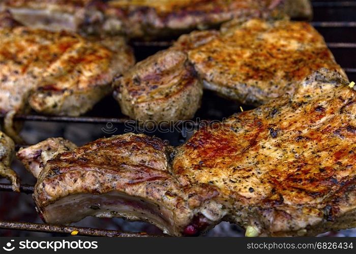 Delicious chuck steaks on the grill. Shallow depth of field.**Note blurriness, best at small sizes.
