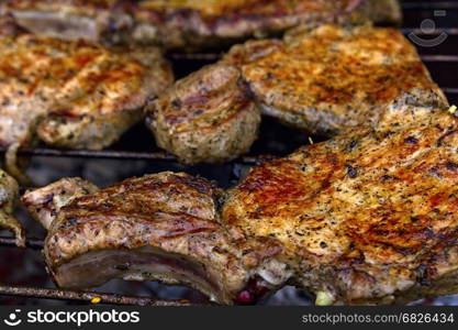 Delicious chuck steaks on the grill. Shallow depth of field.**Note blurriness, best at small sizes.