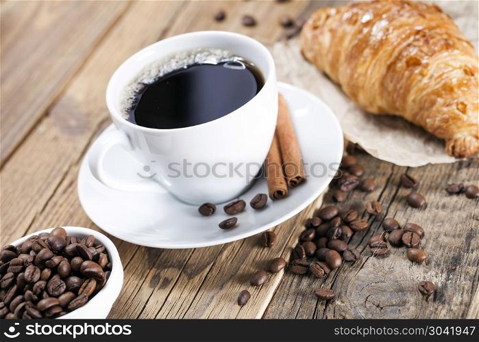 Delicious coffee with sweets on a wooden table. Delicious coffee with sweets on a wooden table, studio shoot