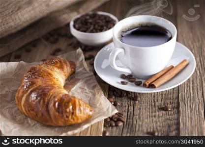 Delicious coffee with sweets on a wooden table. Delicious coffee with sweets on a wooden table, studio shoot