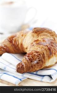 Delicious continental breakfast with coffee and croissant