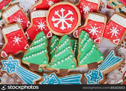 Delicious cookies with Christmas shapes in a red basket