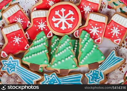 Delicious cookies with Christmas shapes in a red basket