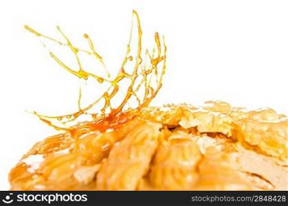 Delicious creamy dessert with caramel topping on isolated background