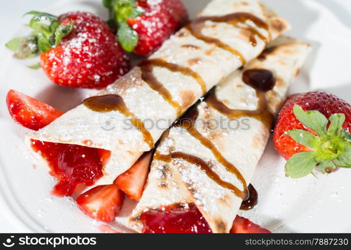 Delicious crepes with strawberry jam fresh candy