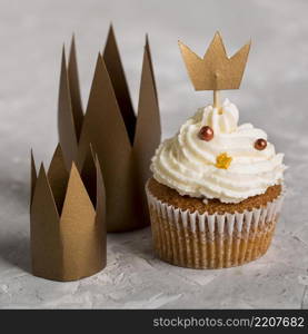 delicious cupcake with crowns high view