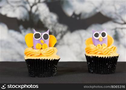 Delicious cupcakes decorated with fondant figures for Halloween