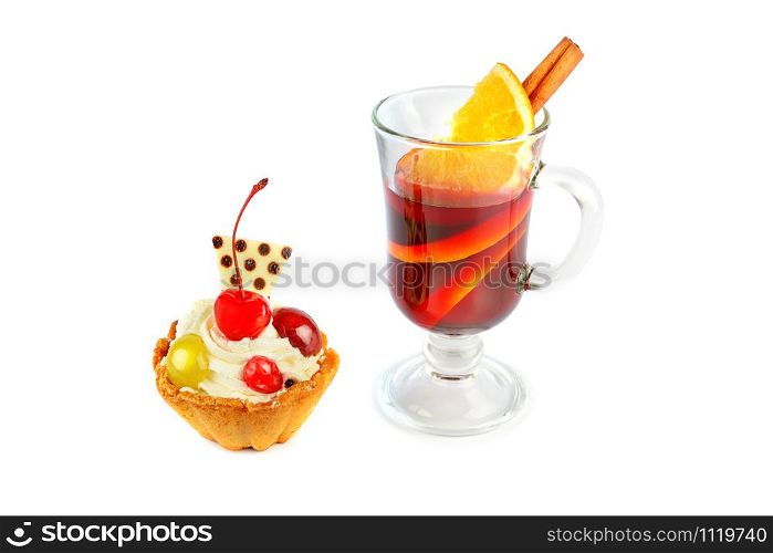 Delicious cupcakes with berries and glass with mulled wine isolated on a white background. Holiday treat.