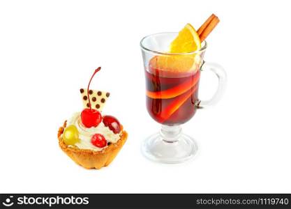 Delicious cupcakes with berries and glass with mulled wine isolated on a white background. Holiday treat.
