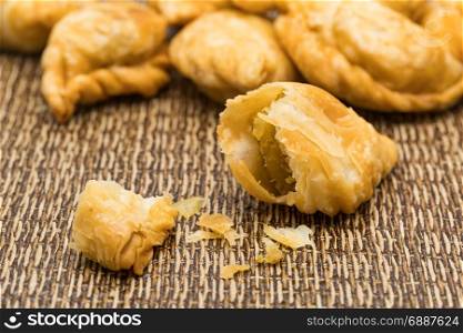 Delicious Curry Puffs on a dark mat