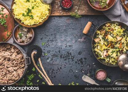 Delicious dish with stewed chopped cabbage and mushrooms, yellow rice and mincemeat on dark background , top view. Rustic food cooking