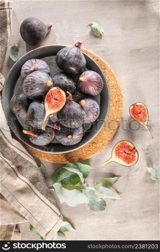Delicious figs in a plate. Kitchen countertop with some ready-to-eat figs. Space for text