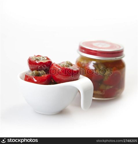Delicious filled red peppers on white background