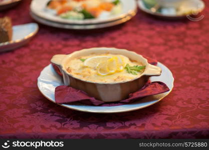 Delicious fish stew dish closeup. At russian dishes - skoblyanka.