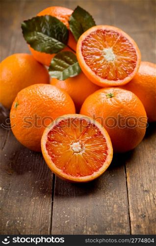 delicious fresh and mature oranges on wooden table