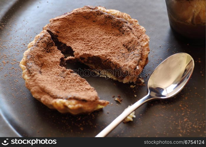 Delicious fresh baked chocolate tart broken ready to serve.