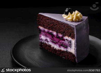 Delicious fresh blueberry or blackcurrant cake with cream cheese on a dark concrete background. Delicious fresh blueberry or blackcurrant cake with cream cheese