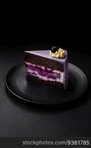 Delicious fresh blueberry or blackcurrant cake with cream cheese on a dark concrete background. Delicious fresh blueberry or blackcurrant cake with cream cheese