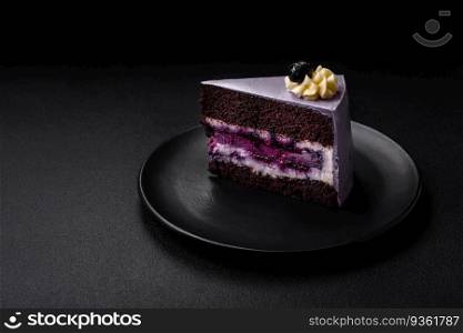 Delicious fresh blueberry or blackcurrant cake with cream cheese on a dark concrete background. Delicious fresh blueberry or blackcurrant cake with cream cheese