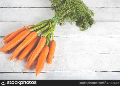 Delicious fresh carrots on a vintage table