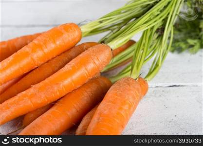Delicious fresh carrots on a vintage table