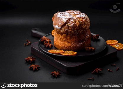 Delicious fresh christmas pie with fruit and raisin panettone on a dark concrete background