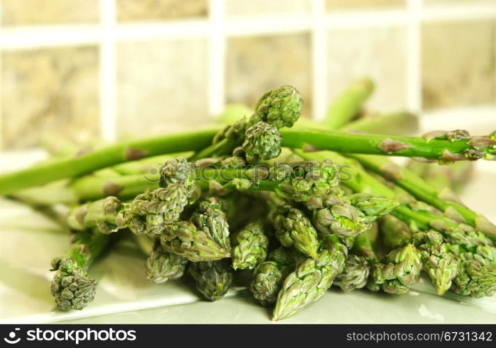 Delicious fresh green asparagus spears with copy space.