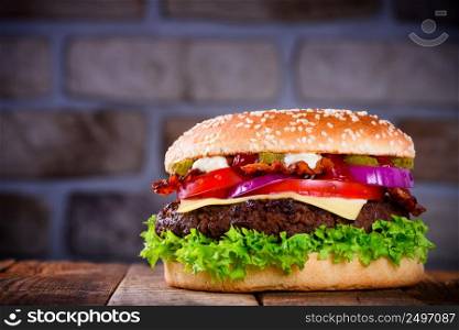 Delicious fresh hamburger on wooden table